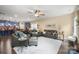 Open-concept living space showcasing hardwood floors, ceiling fan, lots of natural light and a gourmet kitchen at 8232 Bretton Woods Dr, Charlotte, NC 28227