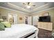 Inviting main bedroom with tray ceiling, hardwood floors, and ample natural light at 8232 Bretton Woods Dr, Charlotte, NC 28227