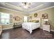 Bright primary bedroom with a trey ceiling, hardwood floors, shutters and abundant natural light at 8232 Bretton Woods Dr, Charlotte, NC 28227