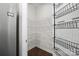 Organized pantry with shelving for efficient storage next to the refrigerator at 8232 Bretton Woods Dr, Charlotte, NC 28227