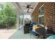 Inviting covered porch with ceiling fans and comfortable seating perfect for relaxing and entertaining at 8232 Bretton Woods Dr, Charlotte, NC 28227