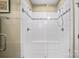 Bright shower area with bench seating, white tile, and decorative accent tiles at 8232 Bretton Woods Dr, Charlotte, NC 28227