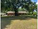 Spacious, shaded backyard with mature trees offers a serene and private outdoor space at 8616 Fallsdale Dr, Charlotte, NC 28214