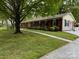 Attractive single-story brick home featuring a well-maintained lawn and a sidewalk at 8616 Fallsdale Dr, Charlotte, NC 28214