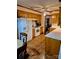 Traditional kitchen with white appliances, wood cabinets, and brick-patterned flooring at 8616 Fallsdale Dr, Charlotte, NC 28214
