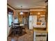 Open kitchen and dining area with updated appliances, tile flooring, and modern lighting at 8616 Fallsdale Dr, Charlotte, NC 28214