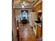 Bright kitchen with dining table, tile floors, and plentiful cabinet space with white appliances at 8616 Fallsdale Dr, Charlotte, NC 28214