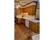 Kitchen with wood cabinets, white appliances, double sink, and eat-in dining space at 8616 Fallsdale Dr, Charlotte, NC 28214