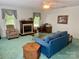 Cozy living room with a fireplace, comfortable seating, and bright natural light at 8616 Fallsdale Dr, Charlotte, NC 28214