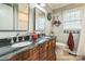 Bathroom with double vanity, dark granite countertops, and decorative mirrors at 1005 Fieldstone Rd, Mooresville, NC 28115