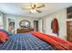 Bedroom featuring a large bed, hardwood floors, and access to an attached bathroom at 1005 Fieldstone Rd, Mooresville, NC 28115