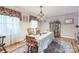 Formal dining room with hardwood floors, windows, and elegant decor at 1005 Fieldstone Rd, Mooresville, NC 28115