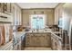 Well-lit kitchen with granite countertops, custom cabinets, and modern appliances at 1005 Fieldstone Rd, Mooresville, NC 28115
