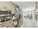 Modern kitchen with stainless steel appliances and view to dining area at 1005 Fieldstone Rd, Mooresville, NC 28115