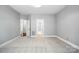 Bedroom featuring neutral carpet, gray walls, and multiple doorways at 104 Fairwind Ct, Fort Mill, SC 29708