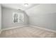 Light-filled bedroom featuring neutral carpet and a large window at 104 Fairwind Ct, Fort Mill, SC 29708