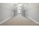 Spacious bedroom with carpet floors, ceiling fan, and natural light from a single window at 104 Fairwind Ct, Fort Mill, SC 29708