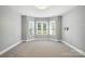 Inviting bedroom with neutral carpet, and lots of natural light from bay windows at 104 Fairwind Ct, Fort Mill, SC 29708