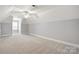 Large, neutral bedroom with carpet flooring and a ceiling fan at 104 Fairwind Ct, Fort Mill, SC 29708