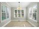 Cozy breakfast nook features bright windows and a stylish chandelier at 104 Fairwind Ct, Fort Mill, SC 29708