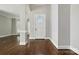 Bright foyer with hardwood floors, offering a welcoming entrance to the home's interior spaces at 104 Fairwind Ct, Fort Mill, SC 29708