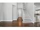 Open interior featuring hardwood floors and a staircase, connecting the home's living spaces with style and functionality at 104 Fairwind Ct, Fort Mill, SC 29708