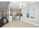 Bright open kitchen and dining area with chandelier at 104 Fairwind Ct, Fort Mill, SC 29708