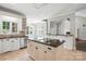 Bright kitchen with white cabinetry and an island, ideal for cooking and gathering, enhancing the home's appeal at 104 Fairwind Ct, Fort Mill, SC 29708