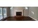 Living room showcasing fireplace, large window, and French doors to the outdoor at 104 Fairwind Ct, Fort Mill, SC 29708