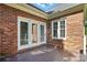 The outdoor patio has access via the double doors and a window letting in ample natural light at 104 Fairwind Ct, Fort Mill, SC 29708