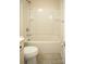 Clean bathroom featuring a tub and shower with storage shelves at 10433 Blairbeth St, Charlotte, NC 28277