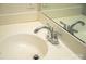 Close up of a pedestal sink and chrome faucet, with a mirror at 10433 Blairbeth St, Charlotte, NC 28277