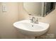 Close up of a sink with chrome faucet and mirror at 10433 Blairbeth St, Charlotte, NC 28277