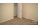 Cozy bedroom boasts neutral paint and carpet at 10433 Blairbeth St, Charlotte, NC 28277
