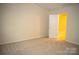 Neutral carpeted bedroom featuring a door to a potential bathroom at 10433 Blairbeth St, Charlotte, NC 28277
