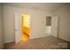 Carpeted bedroom with view into bathroom with vanity at 10433 Blairbeth St, Charlotte, NC 28277