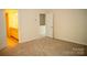 Carpeted bedroom with doors to bathroom and hallway at 10433 Blairbeth St, Charlotte, NC 28277