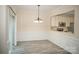 Dining room with wainscoting and views of the kitchen at 10433 Blairbeth St, Charlotte, NC 28277