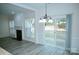 Bright dining area features a modern chandelier and sliding glass doors to the backyard at 10433 Blairbeth St, Charlotte, NC 28277