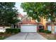Charming brick home with mature trees, a two-car garage and a well-maintained lawn at 10433 Blairbeth St, Charlotte, NC 28277