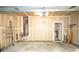 Spacious garage with ample storage, featuring an installed Chamberlain garage door opener and utility hookups at 10433 Blairbeth St, Charlotte, NC 28277