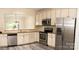Modern kitchen with stainless steel appliances, granite countertops, and ample cabinet space at 10433 Blairbeth St, Charlotte, NC 28277