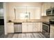 Open kitchen featuring stainless steel appliances, granite countertops, and a pass-through window at 10433 Blairbeth St, Charlotte, NC 28277