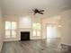 Spacious living room features a fireplace and multiple windows for natural light at 10433 Blairbeth St, Charlotte, NC 28277
