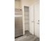 Convenient pantry featuring wire shelving for optimal organization, next to a stainless steel refrigerator at 10433 Blairbeth St, Charlotte, NC 28277