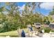 Backyard patio with trees, grill and chairs at 1133 Streamside Ln, York, SC 29745