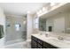 Bathroom featuring modern walk-in shower, tile and a double sink vanity with sleek fixtures at 1133 Streamside Ln, York, SC 29745