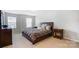 Bright bedroom showcasing a comfortable bed, side tables, and neutral tones, perfect for a relaxing haven at 1133 Streamside Ln, York, SC 29745