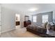 Comfortable bedroom featuring ample natural light with en-suite bathroom, dresser and stylish decor for a serene retreat at 1133 Streamside Ln, York, SC 29745