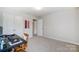 Bright bedroom featuring a desk, closet, and an open doorway to a hallway at 1133 Streamside Ln, York, SC 29745